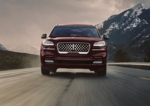 A 2024 Lincoln Aviator® SUV is shown in the Diamond Red exterior color. | Lincoln Demo 4 in Derwood MD