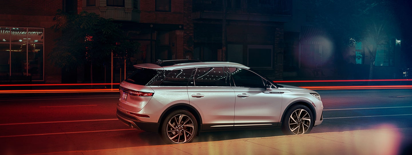 The 2024 Lincoln Corsair® SUV is parked on a city street at night. | Lincoln Demo 4 in Wooster OH