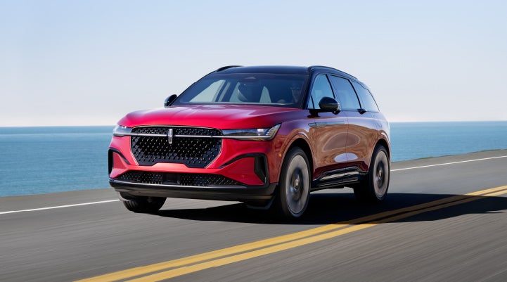 A 2024 Lincoln Nautilus® SUV is being driven on a seaside roadway. | Lincoln Demo 4 in Derwood MD