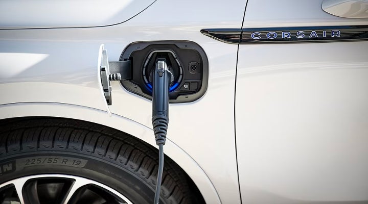 An electric charger is shown plugged into the charging port of a Lincoln Corsair® Grand Touring
model. | Lincoln Demo 4 in Wooster OH