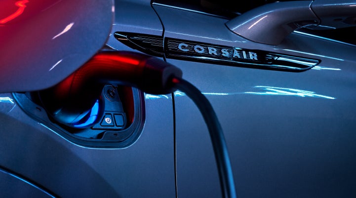 A charger plugged into the charging port of a 2024 Lincoln Corsair® Plug-in Hybrid model. | Lincoln Demo 4 in Wooster OH