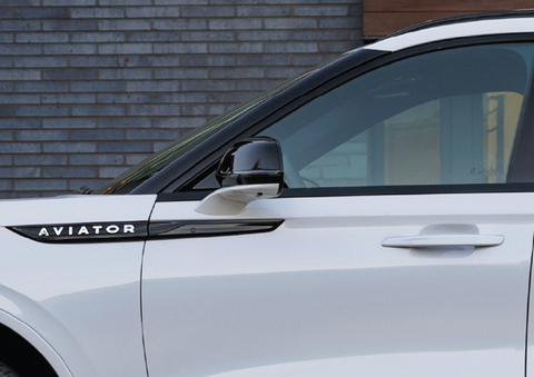The driver’s door of a white 2025 Lincoln Aviator® SUV is showcased. | Lincoln Demo 4 in Derwood MD