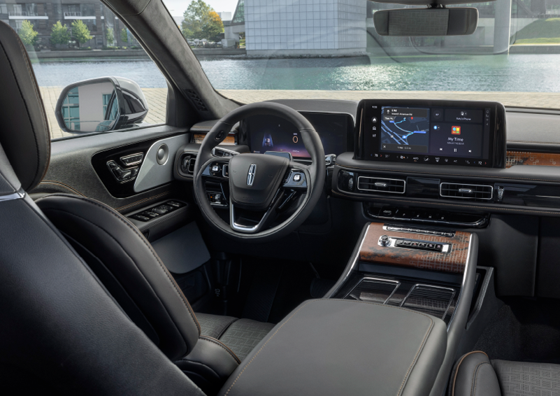The interior of the 2025 Lincoln Aviator® SUV is shown parked with a view of a harbor through the windshield. | Lincoln Demo 4 in Derwood MD