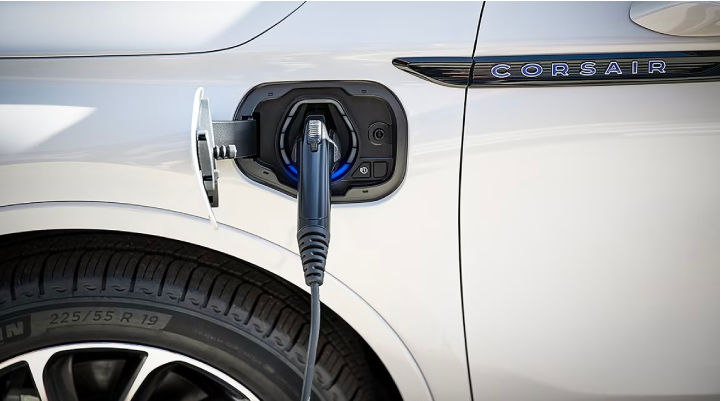An electric charger is shown plugged into the charging port of a Lincoln Corsair® Grand Touring
model. | Lincoln Demo 4 in Derwood MD